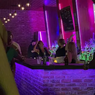 people sitting at a bar