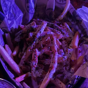 a bowl of fries and a drink