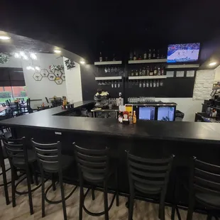 16 seats around the Sports Bar, eat here too!