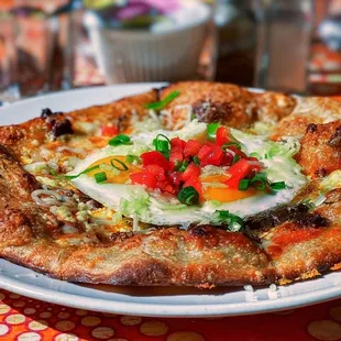 Breakfast Pizza (Local Chorizo, Red Sauce, Cheddar-Jack Cheese, Scallions, Queso Fresco, Fried Eggs)