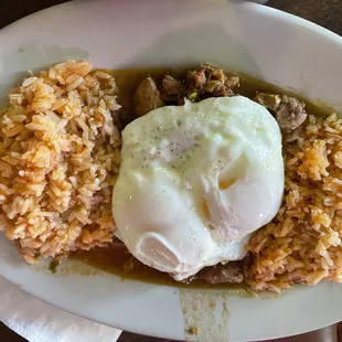 Chili verde, double rice with a couple of fried eggs on top, served with flour tortillas!