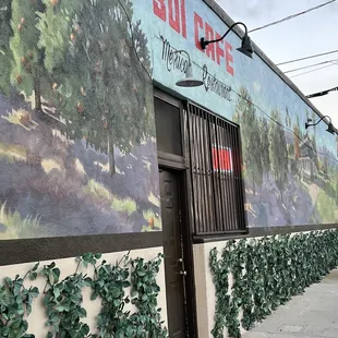 The outside of the building has two entrances front and side.