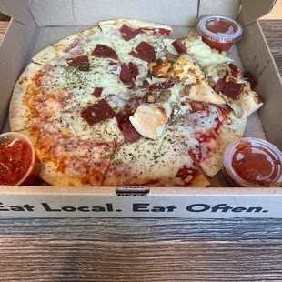Pepperoni pizza and cheese bread with pepperoni and sausage.