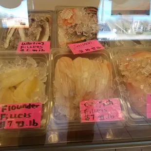 a variety of fish in plastic containers