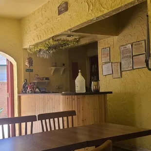 a dining room with a table and chairs