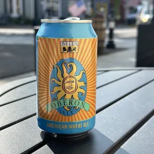 a can of beer sitting on a table