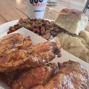 Six piece wings with zingy sauce. The best red beans and rice and cabbage ever and a roll.