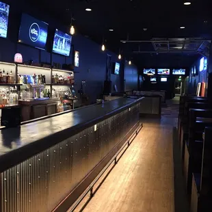 the bar area of a sports bar