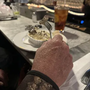 a man eating at a bar