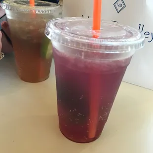 Butterfly pea sparkling limeades. Strawberry in front, pineapple behind.