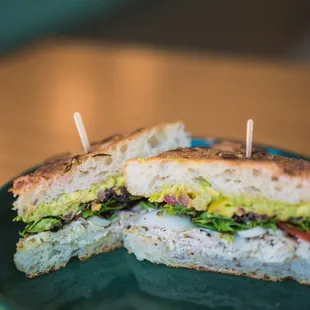 a sandwich cut in half on a plate