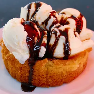 a dessert with ice cream and chocolate sauce