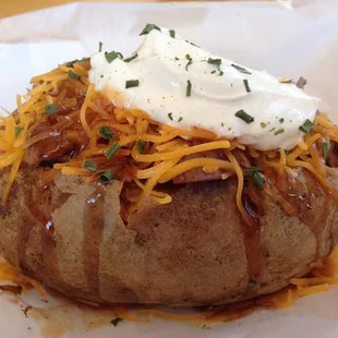 Get our Overstuffed Baked Potato with your choice of pork, chicken, or brisket.