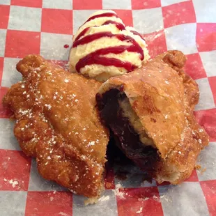 Fresh Fried Chocolate Fried Pie with vanilla ice cream and raspberry sauce.