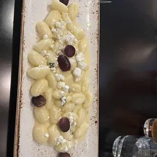 Gnocchi with sage cream sauce and grapes