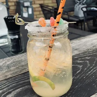 a drink in a mason jar on a table