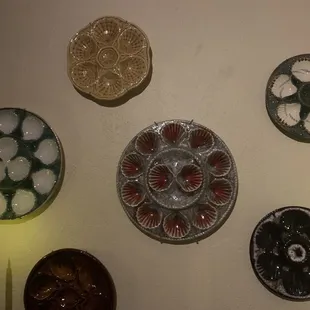 Beautiful oyster dishes on the wall