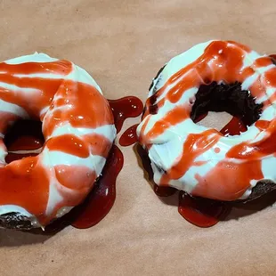 Hot Chocolate Doughnuts with white chocolate icing and Raspberry drizzled. Excellent!
