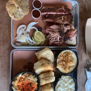 Duo deal with ribs, pulled pork, Mac and cheese, creamed corn and potato salad