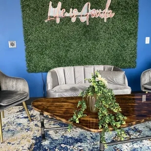 a living room with blue walls and a green wall