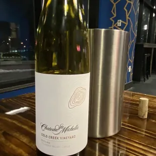 a bottle of wine on a table
