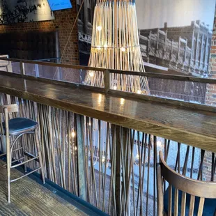 a bar with a wooden table and chairs