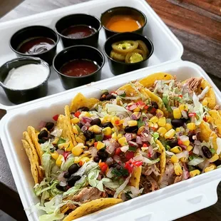 Loaded pulled pork nachos with all the sauces!