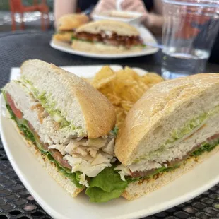 a sandwich and chips on a plate