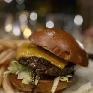 a hamburger and fries on a plate