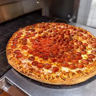 Pepperoni Paradise: there's no such thing as too much pepperoni on our pizza!