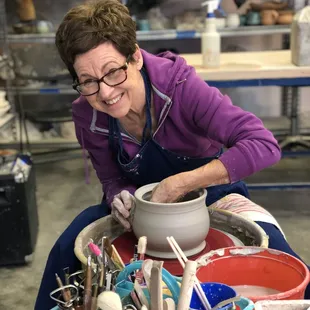 Patty throwing a ceramic pot.