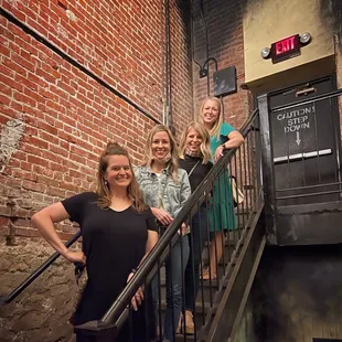 Silly prom stair photo walking down to the speakeasy
