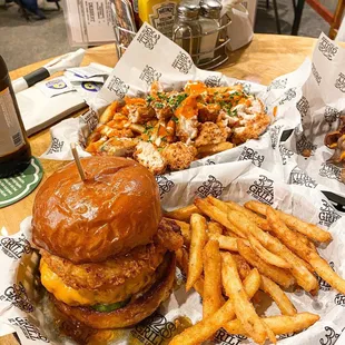 a burger and french fries on a table