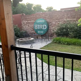 a patio with tables and chairs