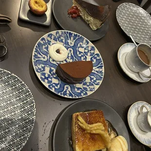 Desserts (from top left): pastéis de nata, basque cheesecake, port chocolate cake, pineapple foster