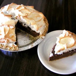 a chocolate pie with a slice taken out of it