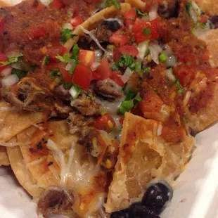 Super nachos: chips, carne asada, black beans, salsa, and cheese.  Reg. $8.69 but with today's Go Dish app $4.34 + tax.