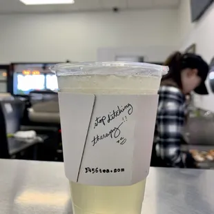 a plastic cup with a sticker on it