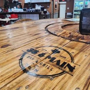 a wooden table with a phone on it
