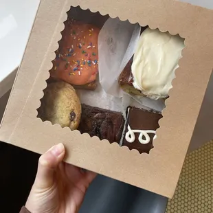 Strawberry pop tart, cinnamon roll, brownie, chocolate snack cake, chocolate chip cookie