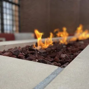 a fire pit with rocks in the foreground