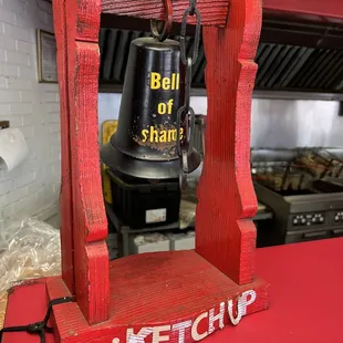 Bell of shame when asking for ketchup.