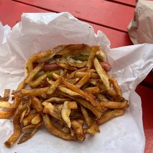 Hotdog with mustard, onion, pepper and fantastic fries.