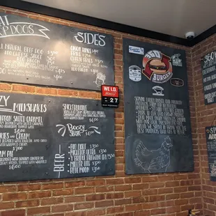 menus on a brick wall