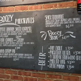a menu on a brick wall