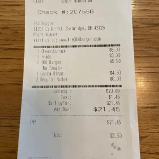 Bill for 2 burgers, basket of fries, basket of onion rings. (We almost always drink water!)