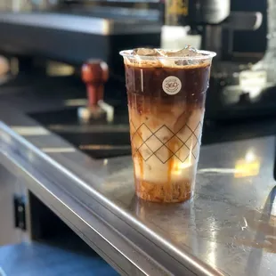 a cup of coffee on a counter