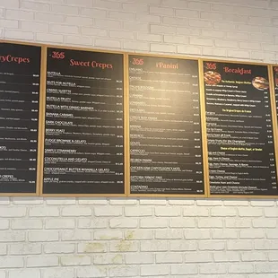 a menu on a brick wall