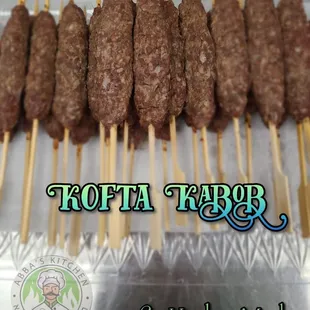 a tray of kebabs on skewers