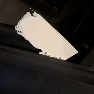 Sticker left behind on driver's side window.